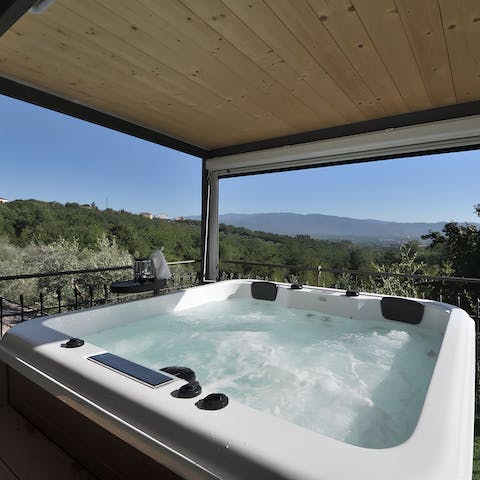 Relax in the hot tub while you enjoy the views of the surrounding hills