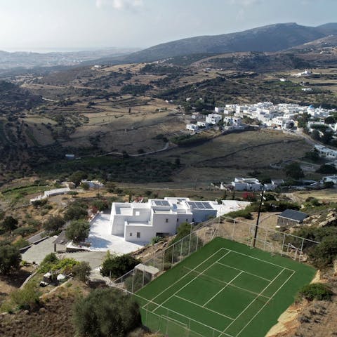 Play tennis with a beautiful backdrop on the villa's private court