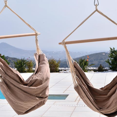 Treat yourself to an afternoon doze in one of the poolside hammocks