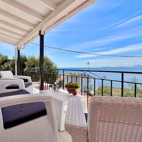 Relax on your private patio and admire the stunning sea views