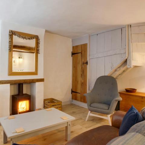 Cosy up by the log burning stove after a walk on Wells Next The Sea Beach