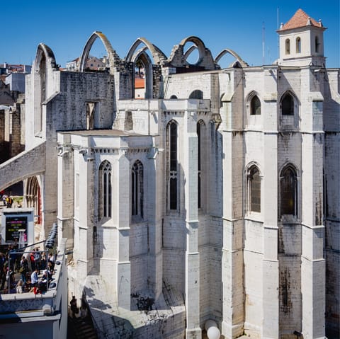Marvel at the medieval Carmo Convent, a seven minute stroll away