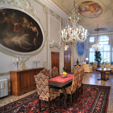 Admire the opulence of the grand salon, with its high ceilings and frescoes