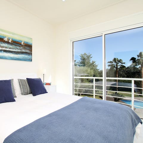 Roll out of bed and head to your own private balcony with views of the pool and the surrounding flora