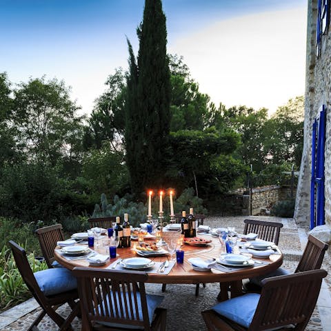 Dine outdoors by candlelight as the sun sinks below the horizon