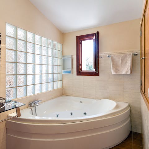 Treat yourself to a luxurious soak in the jacuzzi tub