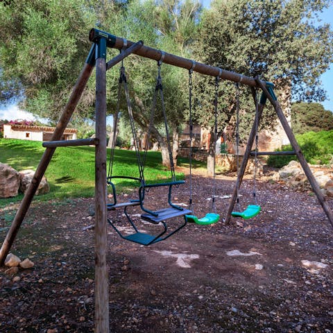 Give the little ones a push on the outdoor swing set