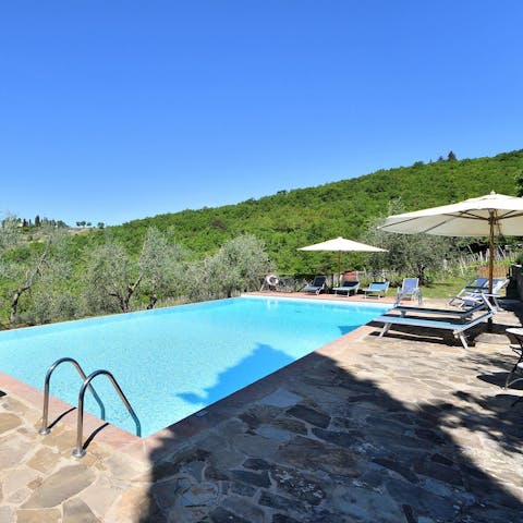 Soak up the sun beside the pool – it's carved into the hillside of an olive grove