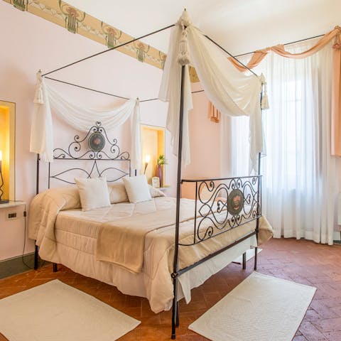 Wake up feeling like royalty in the gorgeous four-poster bed