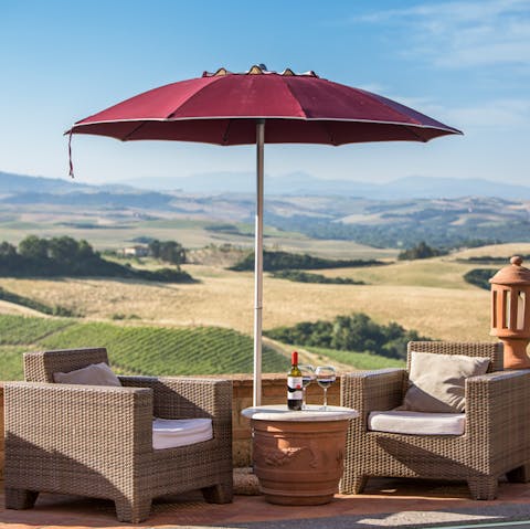 Relax in the shade of the parasol and look out over stunning Tuscan vistas
