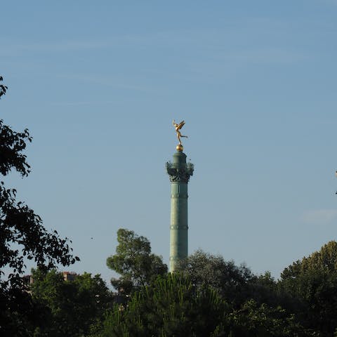 Explore the historic Place de la Bastille, a fifteen-minute stroll away