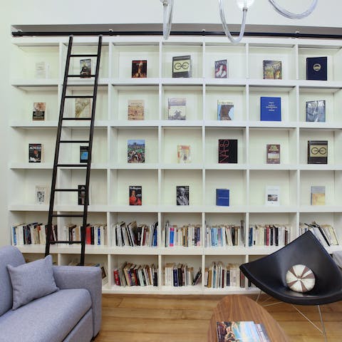 Select a book and settle into the comfy, grey sofa