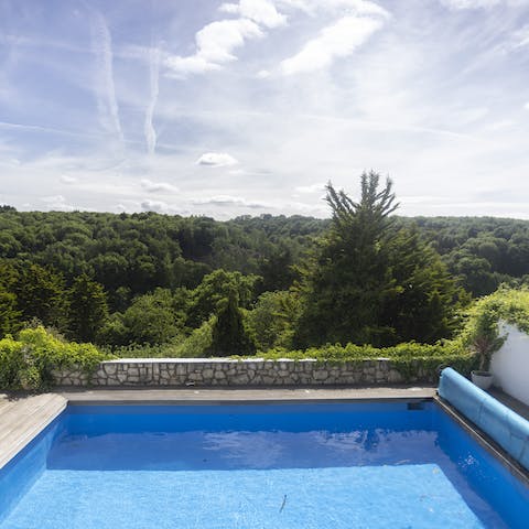 Start your day with a refreshing dip in the swimming pool 