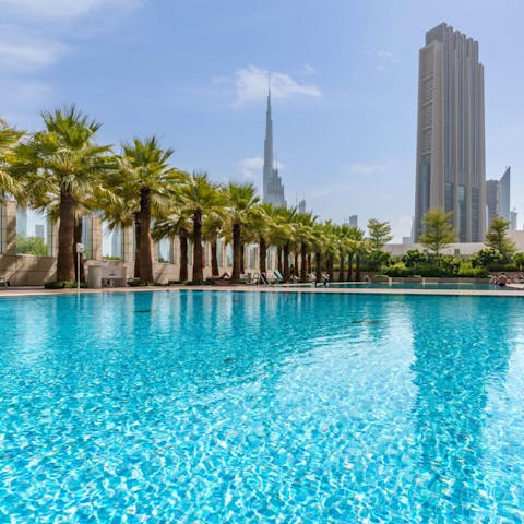 Enjoy a few strokes of the shared pool overlooking the Burj Khalifa