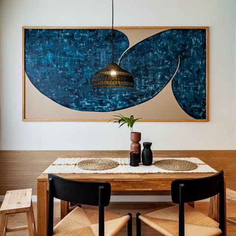 Admire the hand-picked art and Indonesian-inspired decor touches