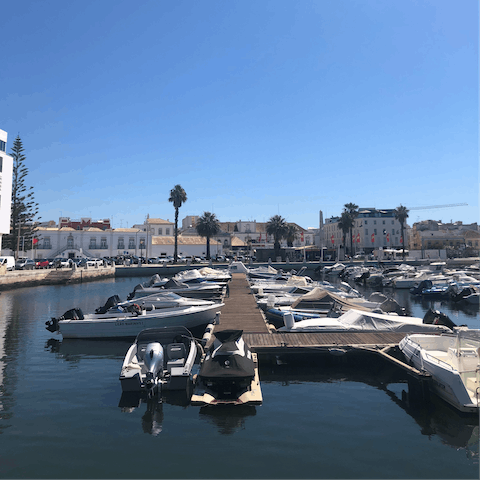 Explore the shops and waterfront restaurants along Faro Marina, a short walk away