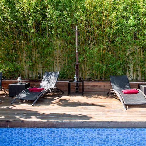 Cool off in the pool, after an afternoon of lounging on the day beds 