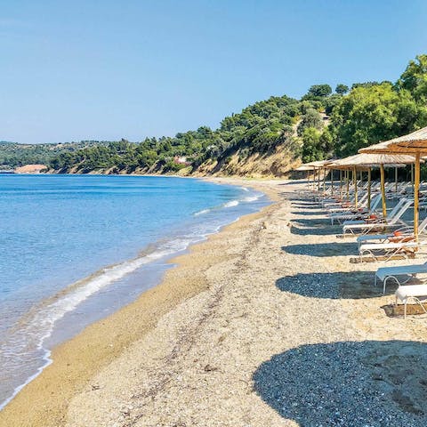 Take a calming stroll on the resort's private beach