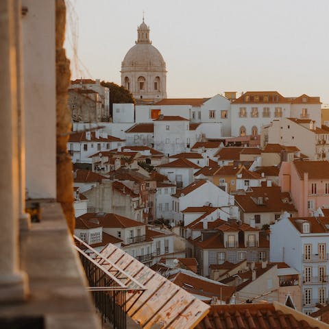 Rise early for stunning sunrise light over the city rooftops – Miradouro de Santa Luzia is a seven-minute walk away