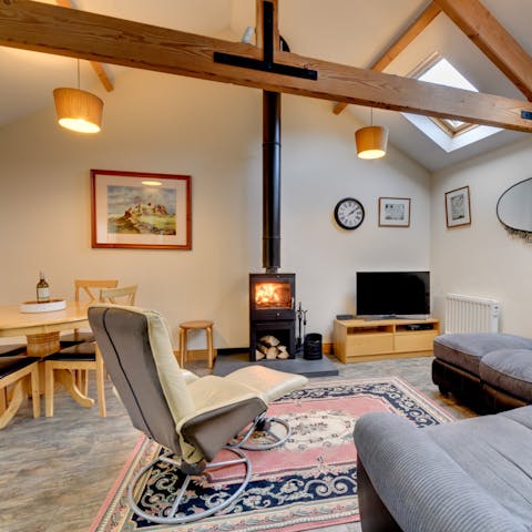 Put your feet up and get toasty next to the multi-fuel stove in the living room