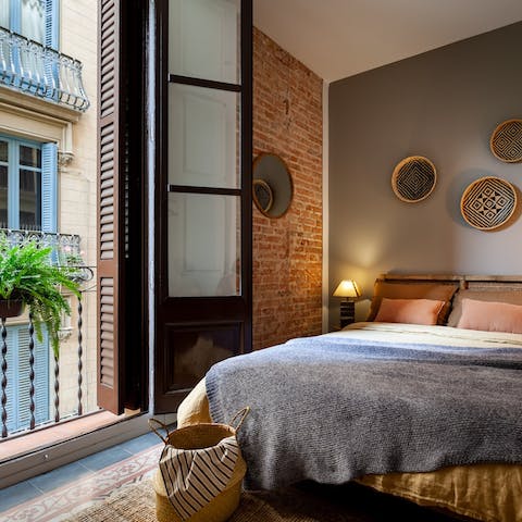 Wake up to views of your Gràcia neighbourhood from the bedrooms' private balconies