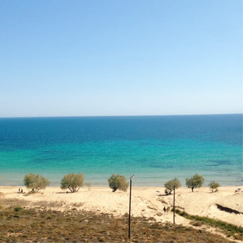Take a five-minute drive to Almirida Beach for a day on the sand
