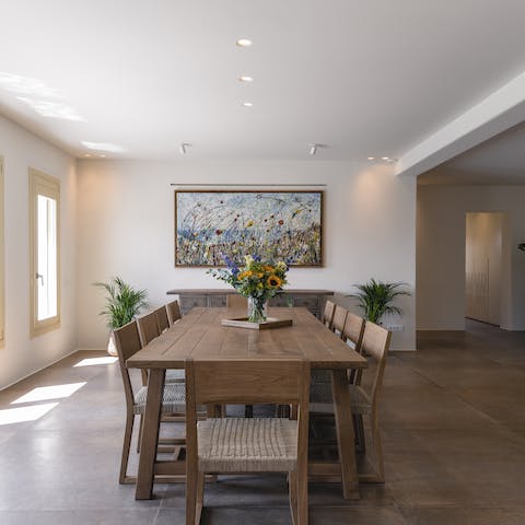 Enjoy meze of olives, flatbread, cheese, and fruit together at this solid wood table