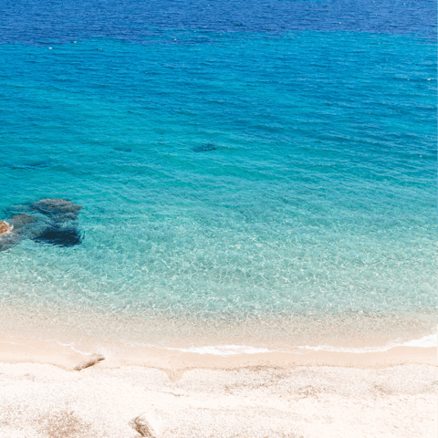 Spend sunny days in the soft sand of Plates Gialos Beach, only minutes away