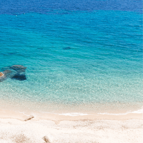 Spend sunny days in the soft sand of Plates Gialos Beach, only minutes away