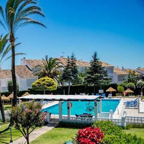 Cool off from the Spanish heat with a dip in the communal outdoor pool