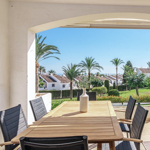 Enjoy palm tree-lined views from your private terrace area