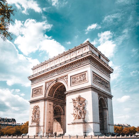 Visit the historical Arc de Triomphe, a twelve minute walk away