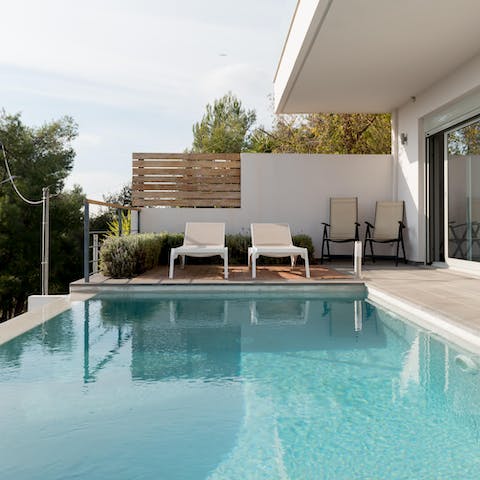 Splash the afternoons away in the sparkling pool on the patio