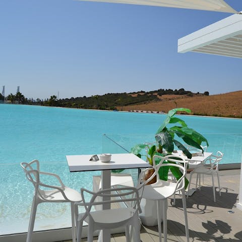 Sip your morning coffee by the turquoise lagoon, only a short walk away