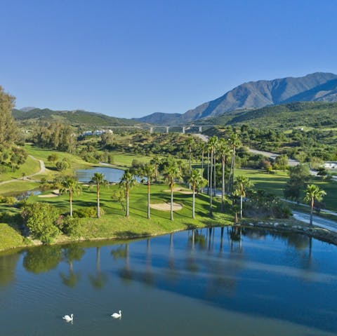 Practise your swing at Estepona Golf, a short drive from home