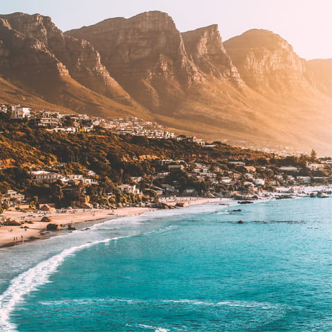 Visit the stunning beaches of Cape Town and see breathtaking mountain backdrops
