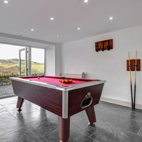 Challenge your neighbours to a pool tournament in this shared games room