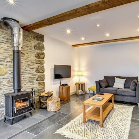 Cosy up around the log burner after enjoying an evening barbecue outside