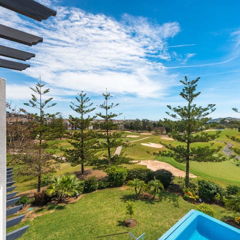 Gaze out over the neighbouring golf course's holes from the balcony