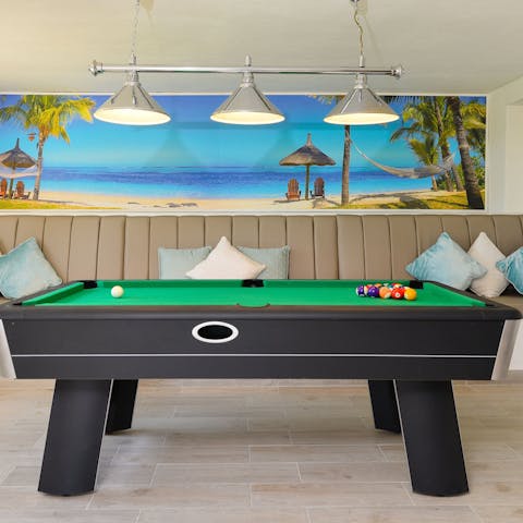 Play a few matches of pool in the games room before taking up residence at the bar