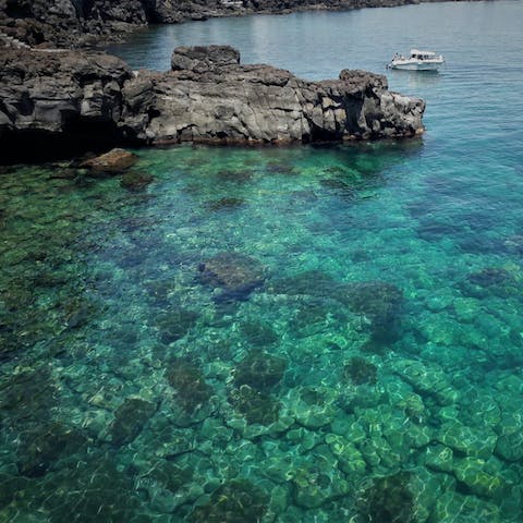 Explore the magical east coast of Sicily – you're just steps away from the Aci Castello seafront