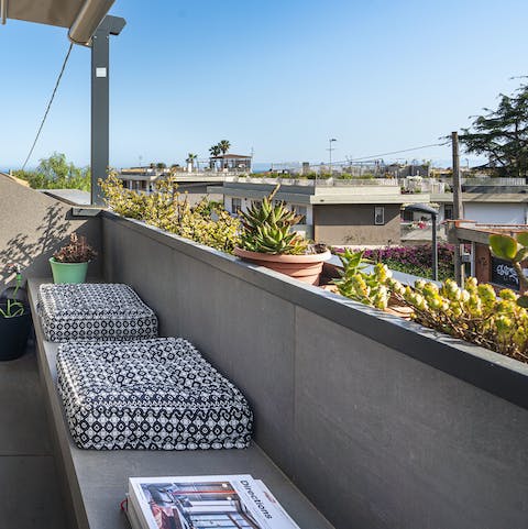 Relax on your cushioned outdoor space, soaking up the last of the afternoon sun and catching up on your book