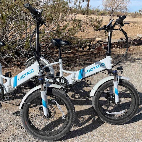 Enjoy a leisurely cycle along unpaved desert tracks on the two electric bikes