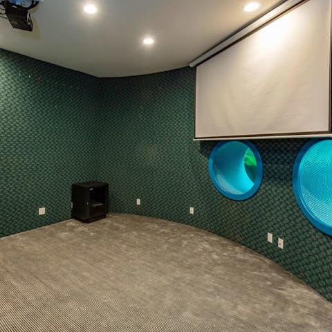 Watch a movie in the home's cinema room