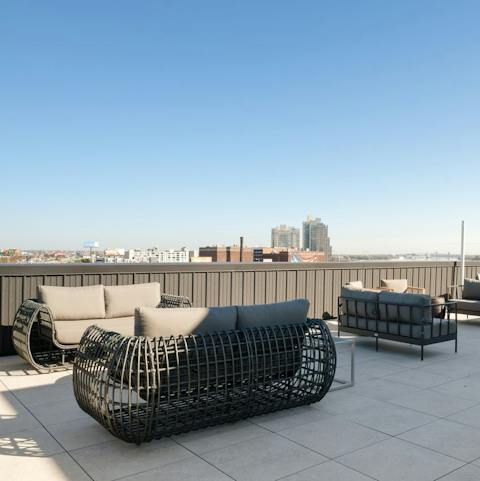 Admire the city views in the sunshine from the shared roof terrace