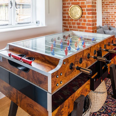 Partake in a game of tabletop football and get everyone involved in the challenge