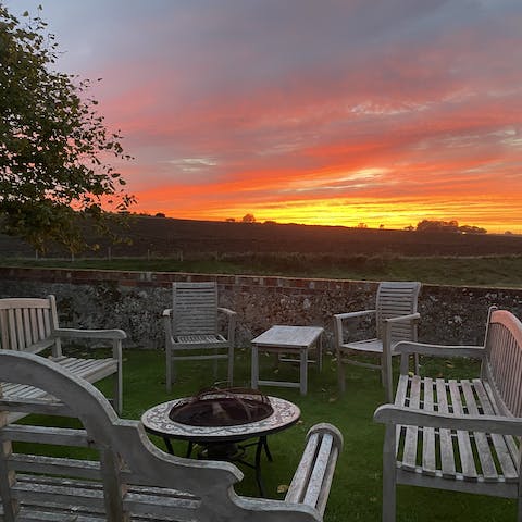 Gather round the firepit and roast marshmallows as the sun sets across the grounds