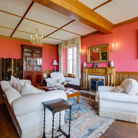 Curl up in front of the fireplace in the cosy sitting room