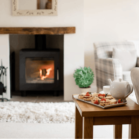 Cuddle up by the roaring wood burner with a cup of tea