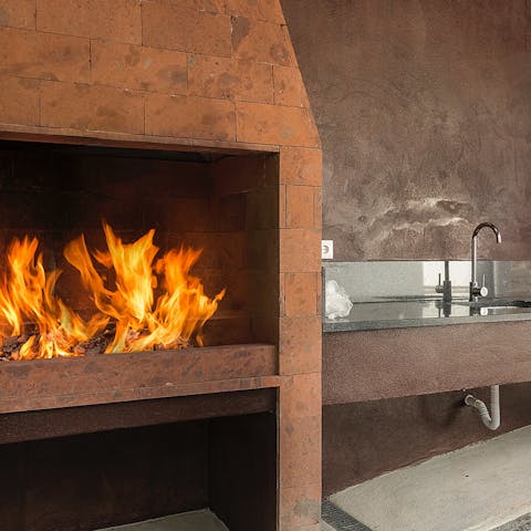 Grill up some espetada on the barbecue in the outdoor kitchen
